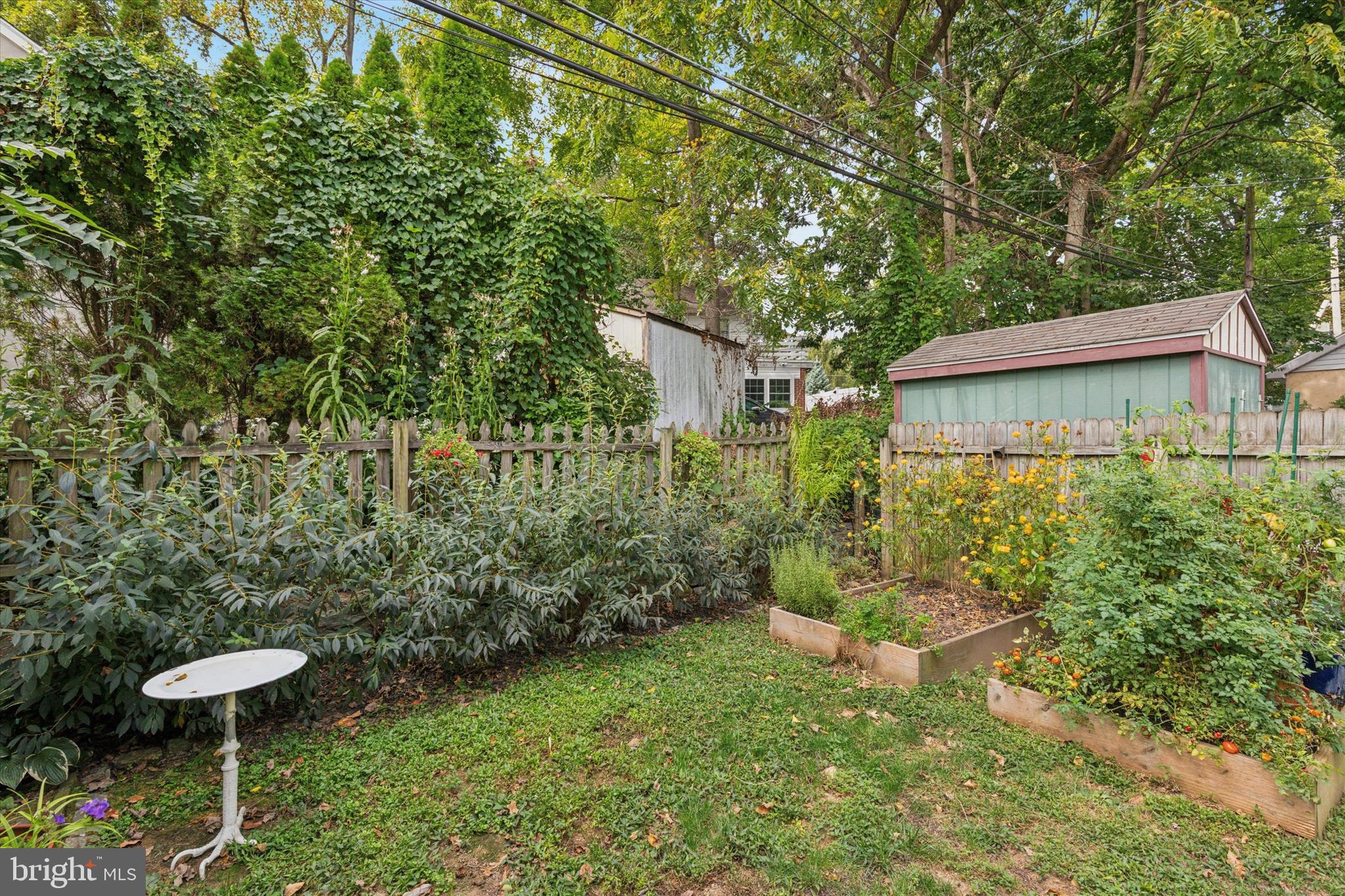 520 Homewood Avenue Narberth, PA 19072 - Photo 23 of 25 a view of a backyard with plants and a fountain