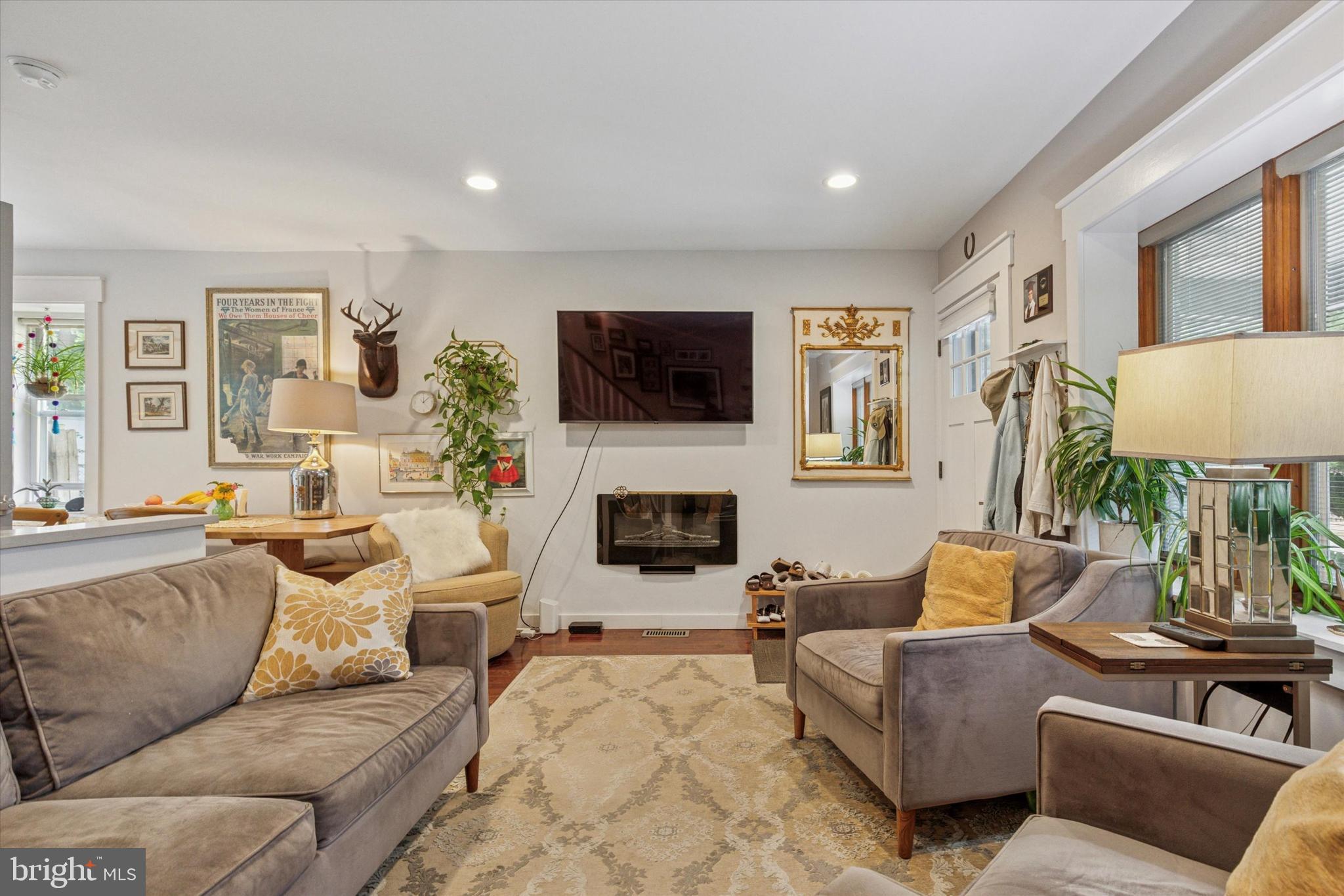 520 Homewood Avenue Narberth, PA 19072 - Photo 4 of 25 a living room with furniture a flat screen tv and a fireplace
