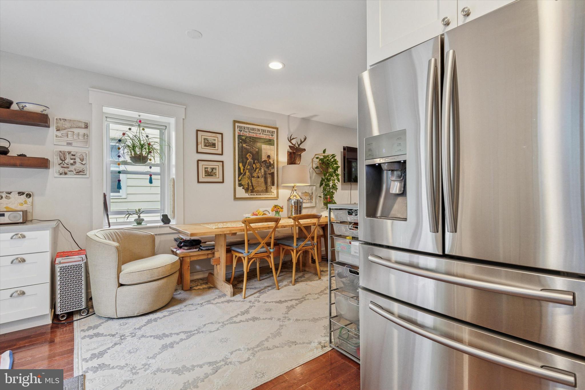 520 Homewood Avenue Narberth, PA 19072 - Photo 9 of 25 a living room with furniture a dining table and a refrigerator