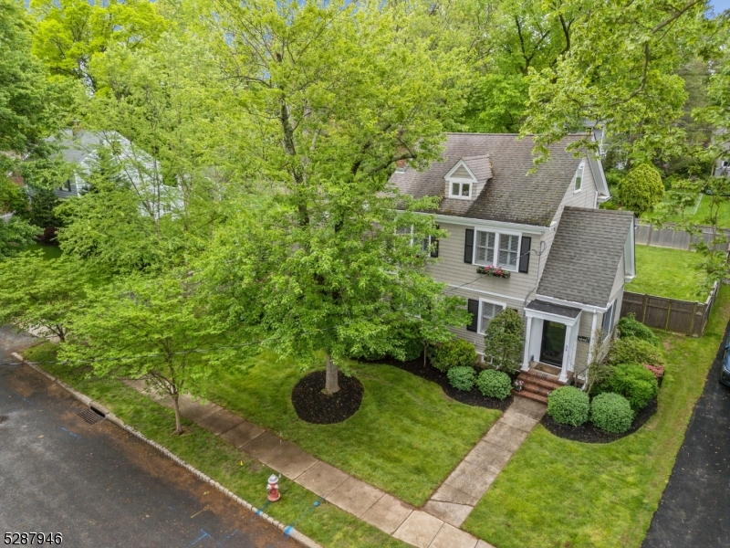 a aerial view of a house with yard