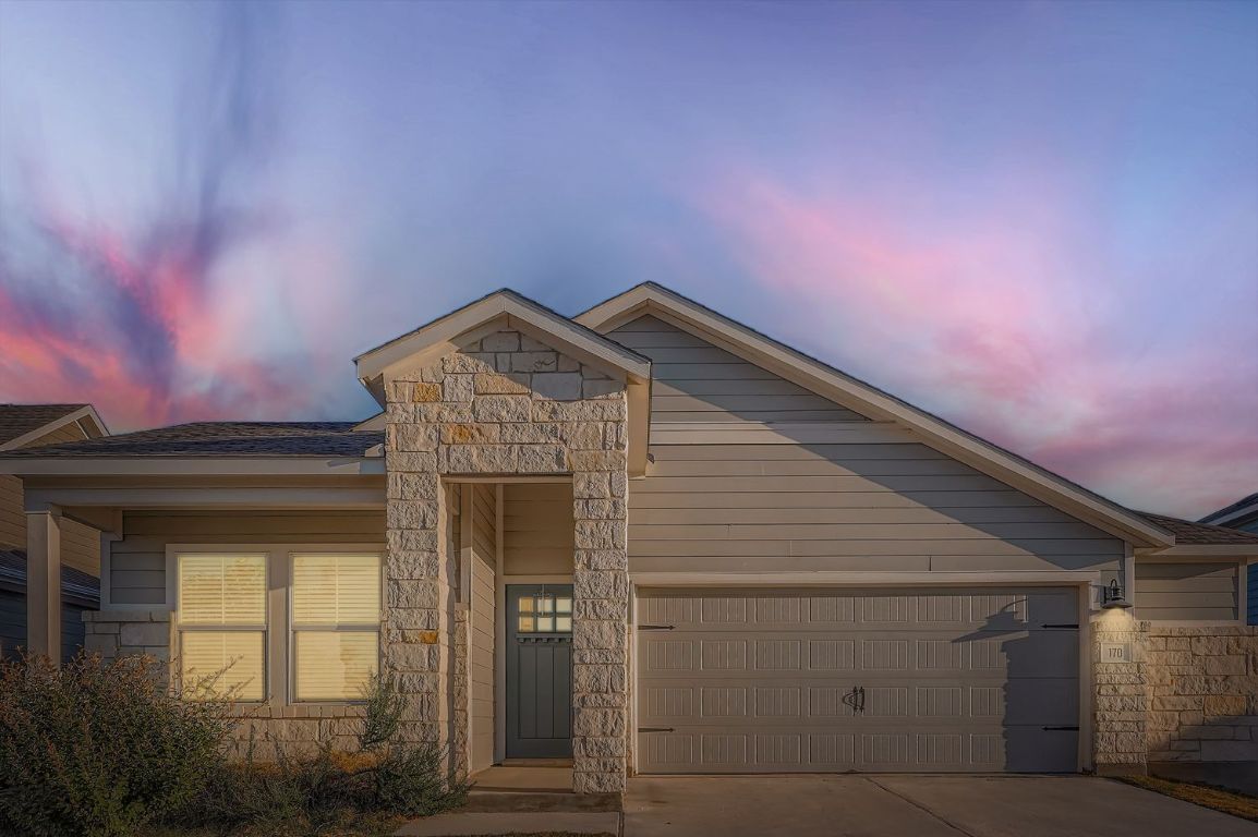 a front view of a house with a garage