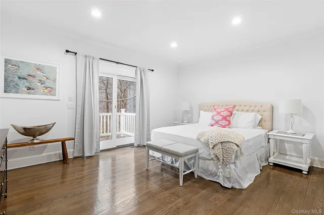 a bedroom with a bed and a chair