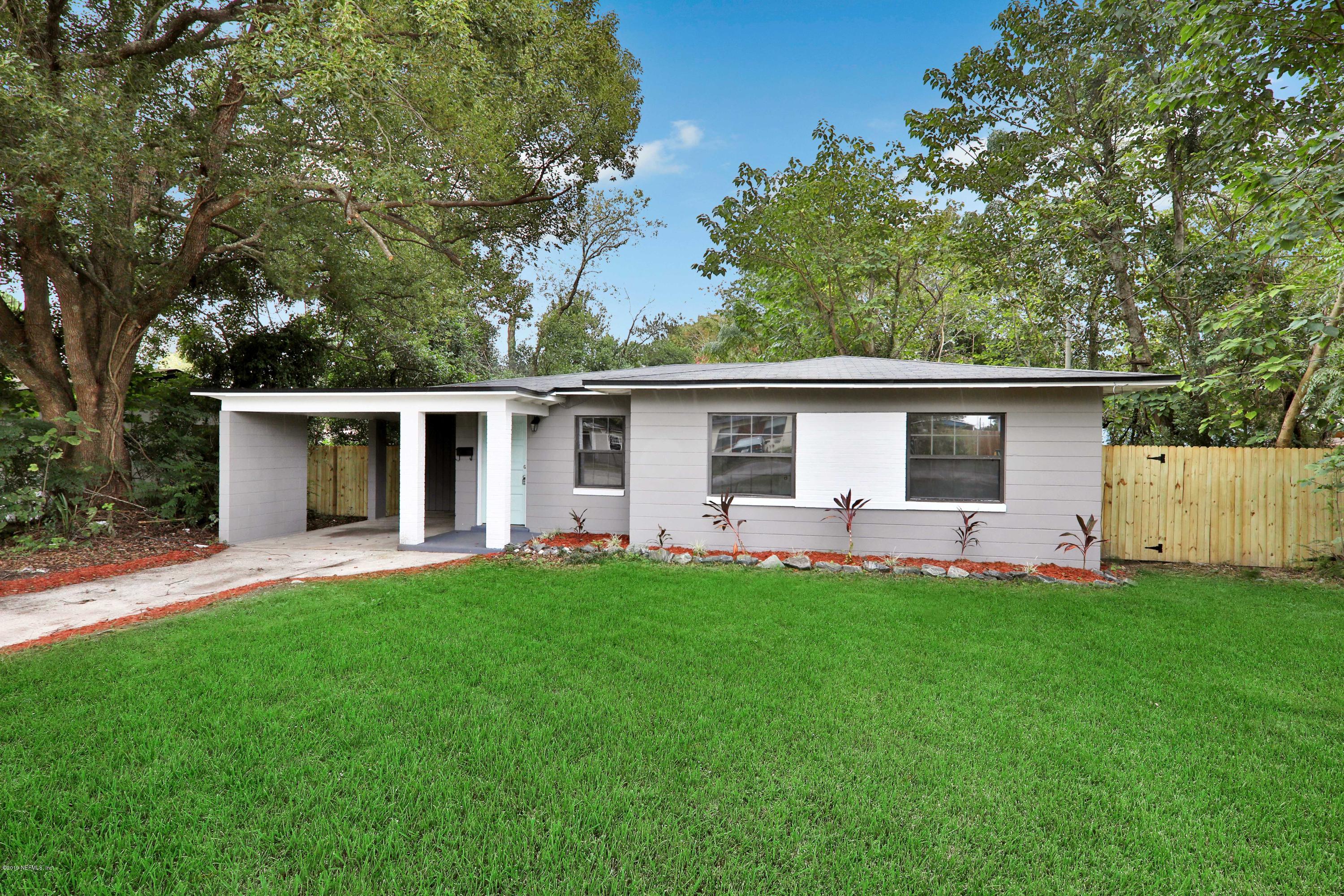 10512 Stone Road Jacksonville, FL 32246 - Photo 1 of 22 front view of a house with a yard