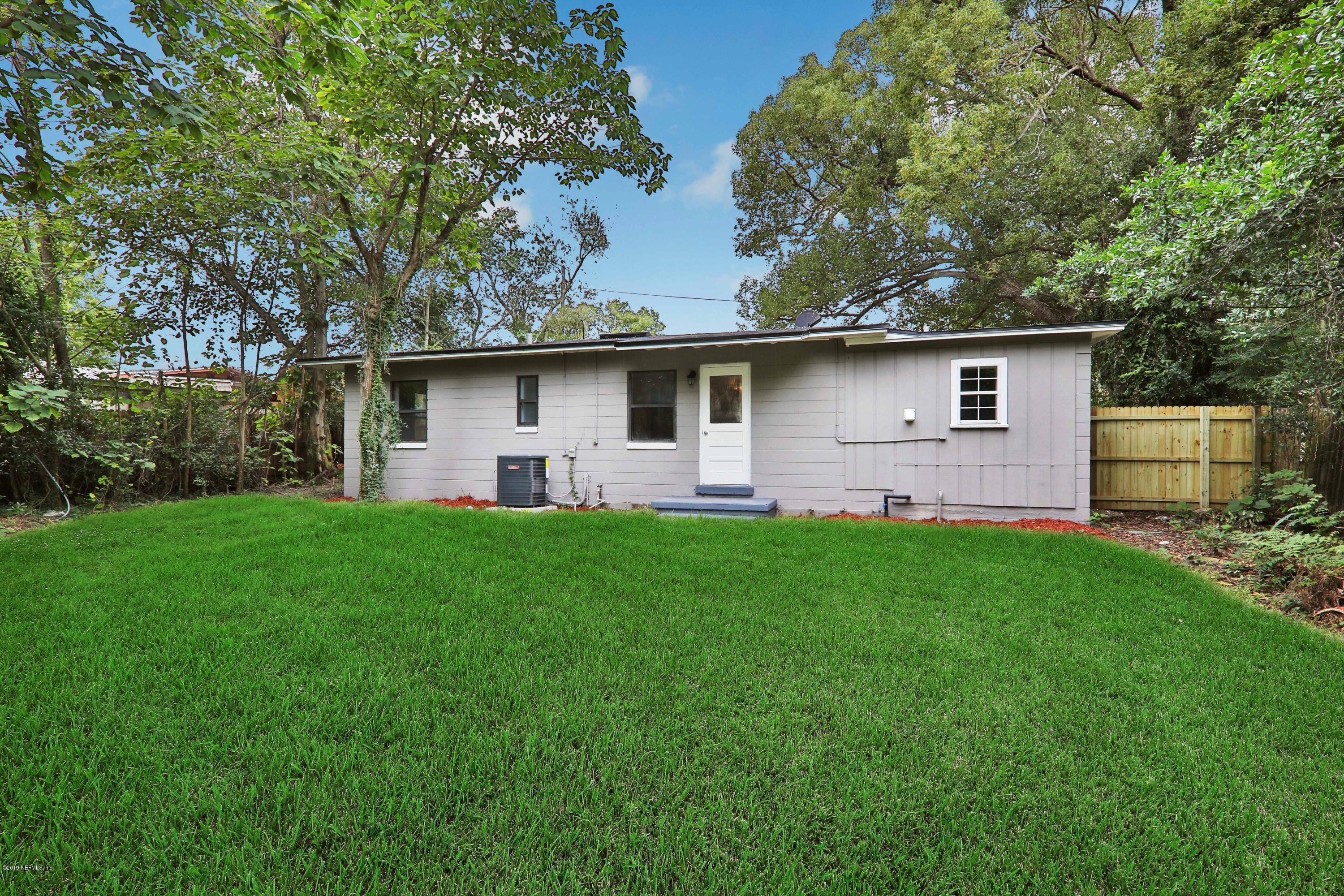 10512 Stone Road Jacksonville, FL 32246 - Photo 18 of 22 a front view of house with yard and green space