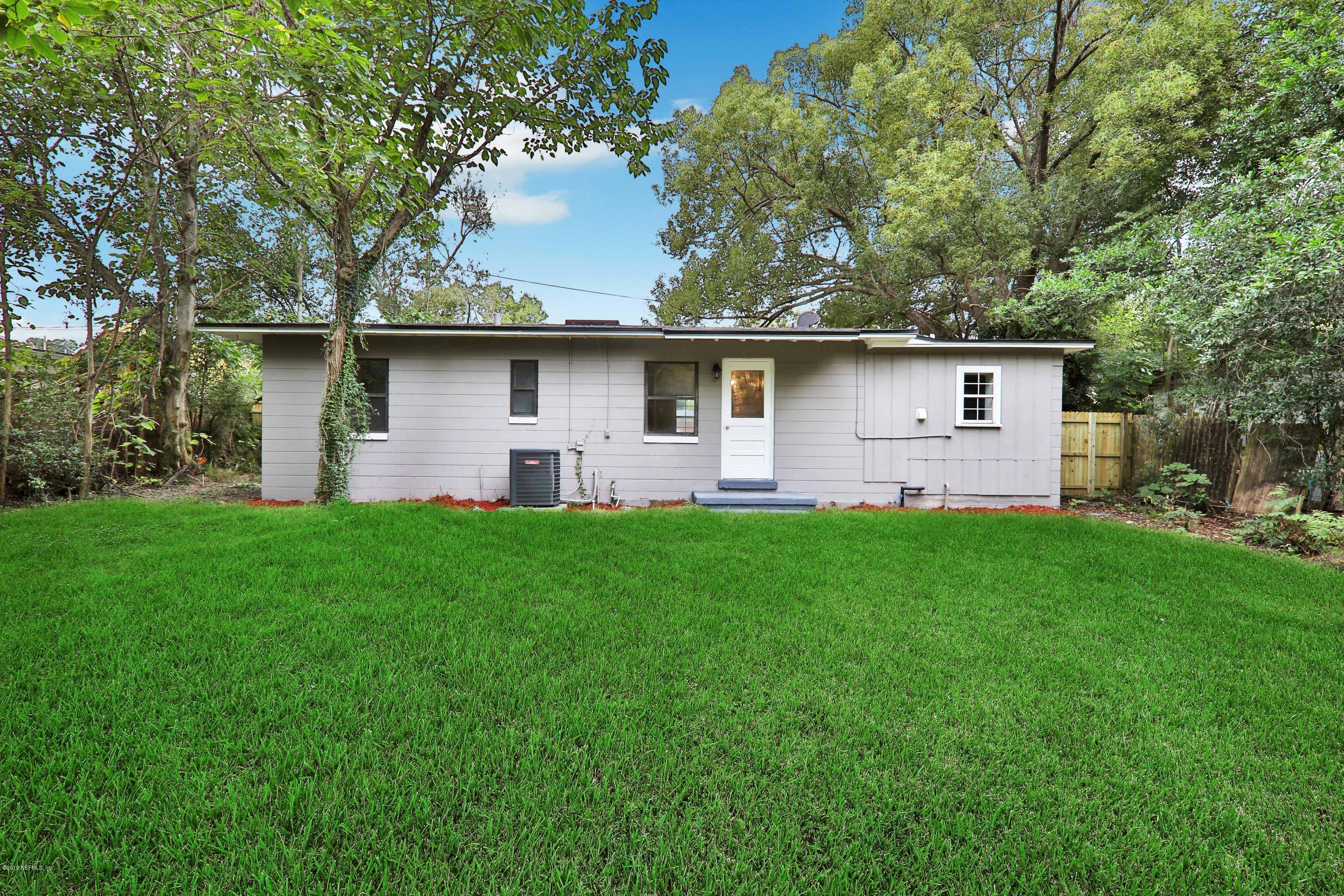 10512 Stone Road Jacksonville, FL 32246 - Photo 19 of 22 a front view of house with yard and green space