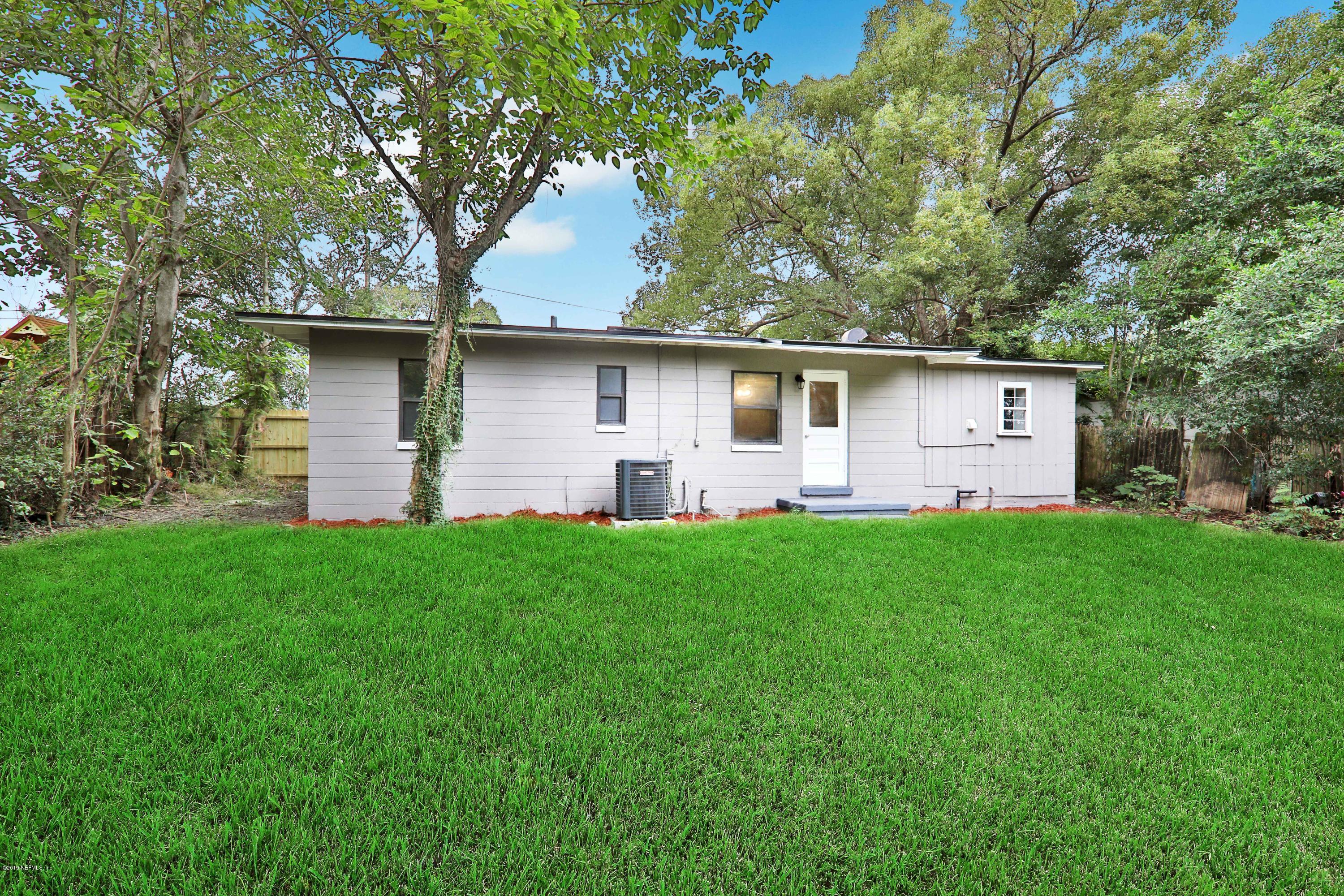 10512 Stone Road Jacksonville, FL 32246 - Photo 20 of 22 a front view of house with yard and green space