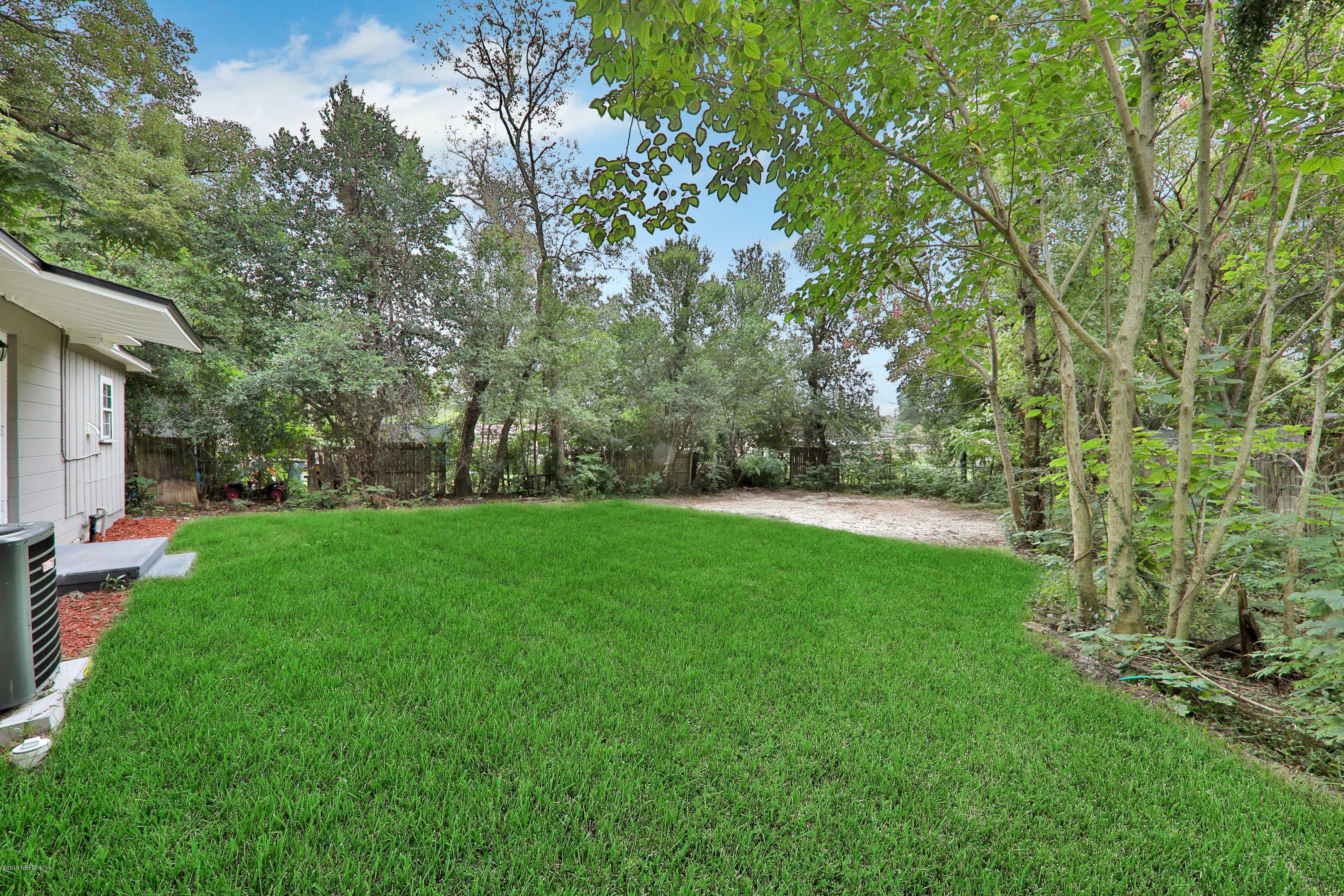 10512 Stone Road Jacksonville, FL 32246 - Photo 21 of 22 a view of a backyard with large trees