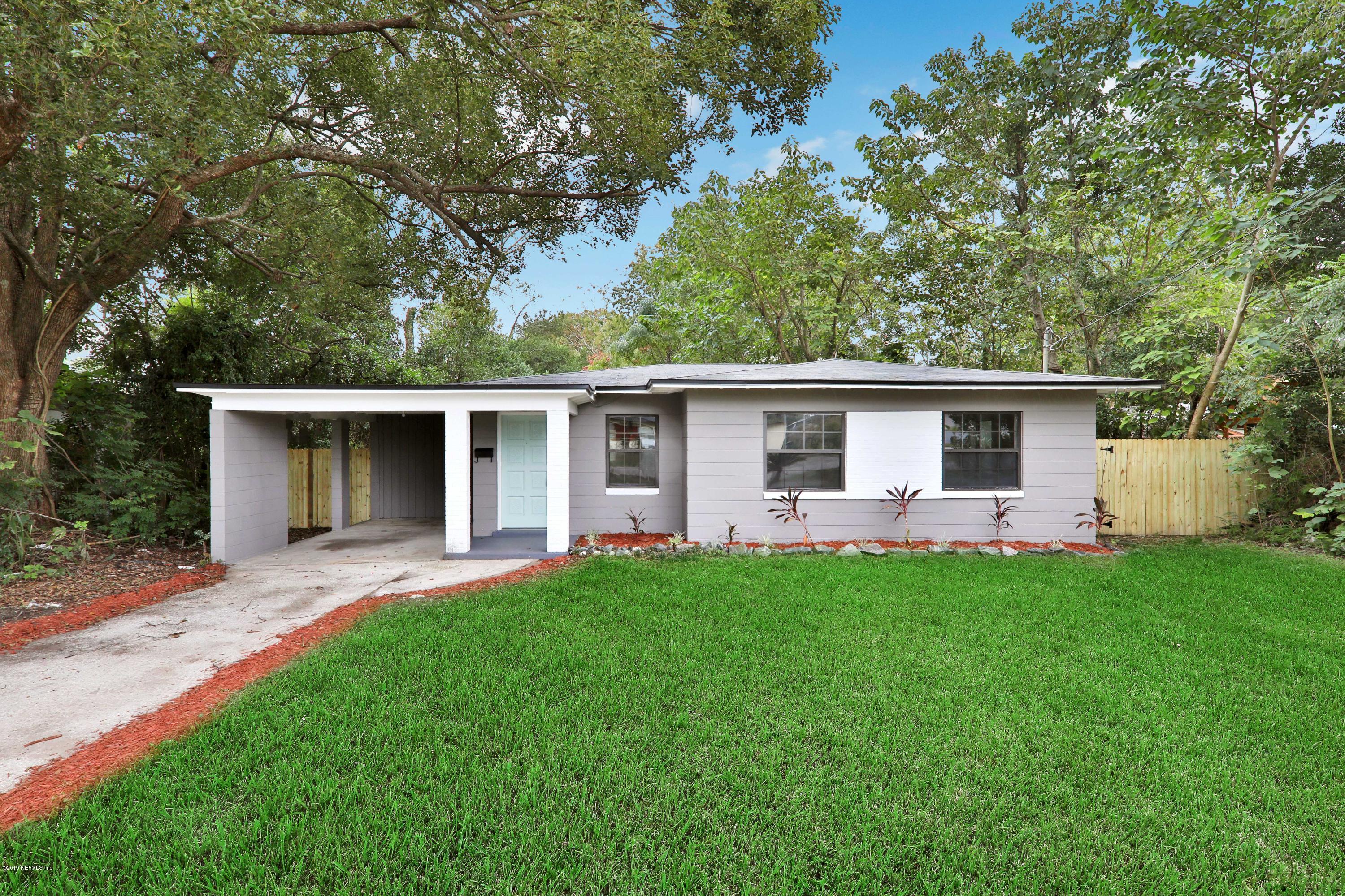 10512 Stone Road Jacksonville, FL 32246 - Photo 22 of 22 a front view of house with yard and green space
