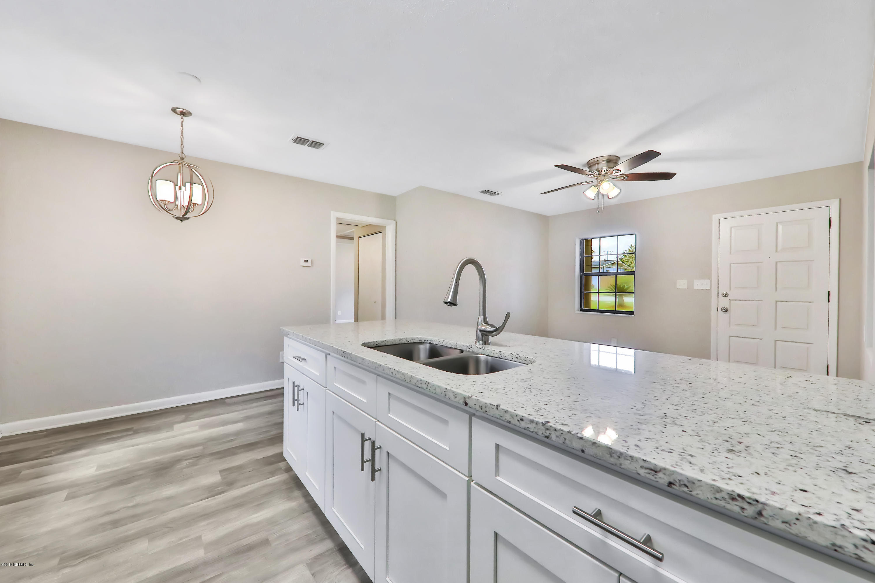 10512 Stone Road Jacksonville, FL 32246 - Photo 5 of 22 a view of a double sink and chandelier