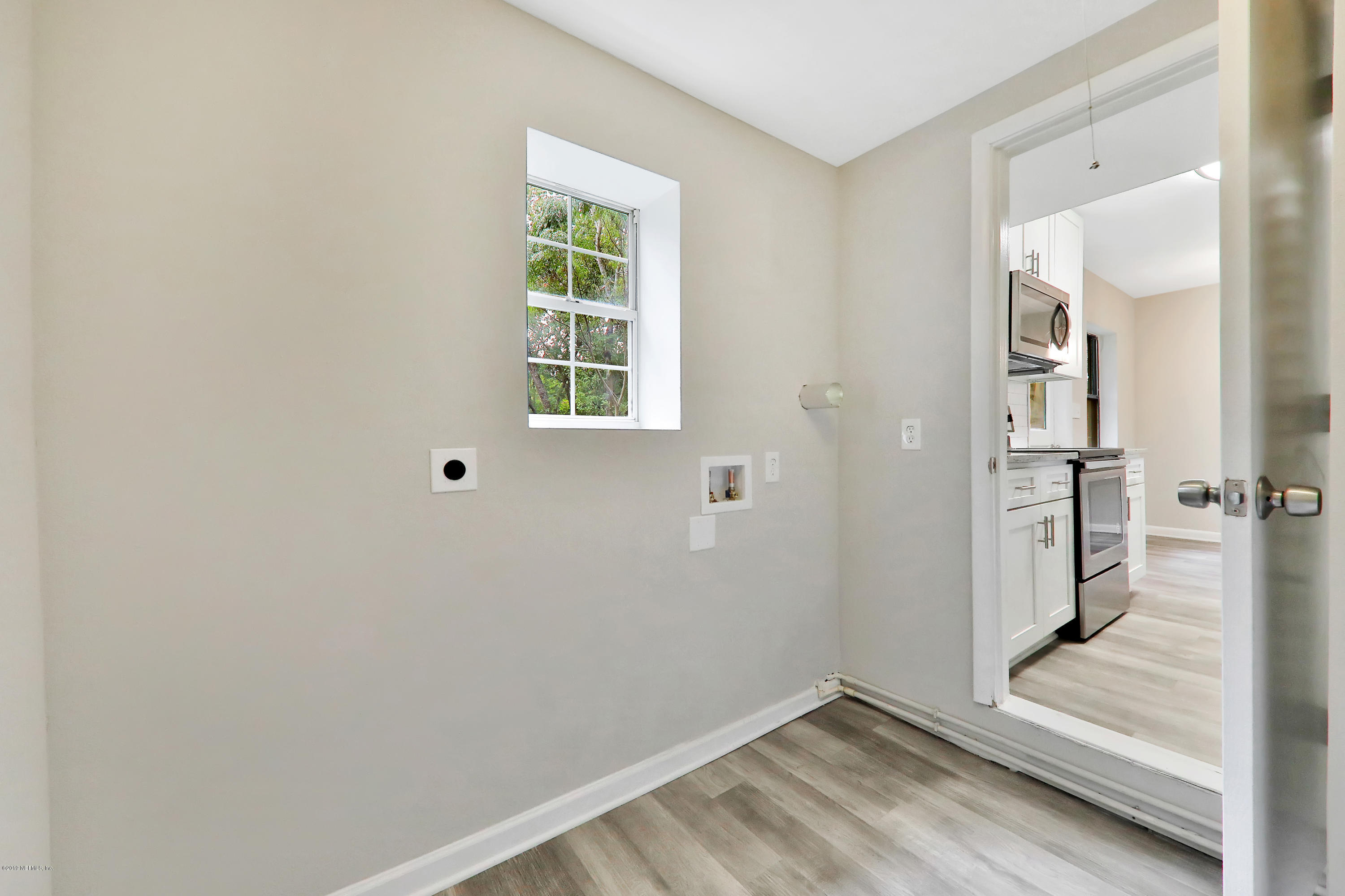 10512 Stone Road Jacksonville, FL 32246 - Photo 10 of 22 an empty room with windows