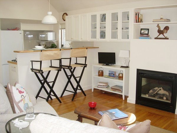 24 R Pearl Street, Unit 24R Marblehead, MA 01945 - Photo 3 of 14 a living room with furniture and a fireplace