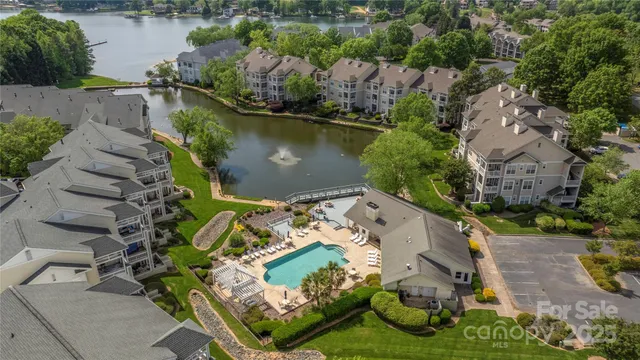 an aerial view of a house with a lake view