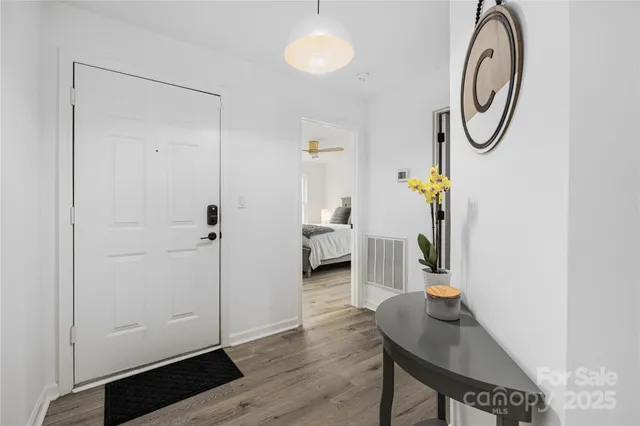 a view of entryway with wooden floor