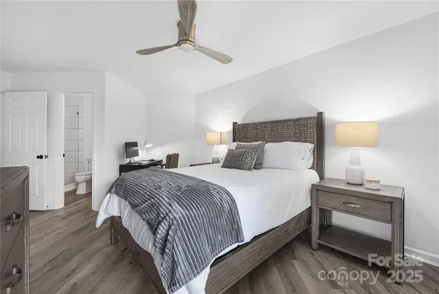 a bedroom with bed and a night lamp