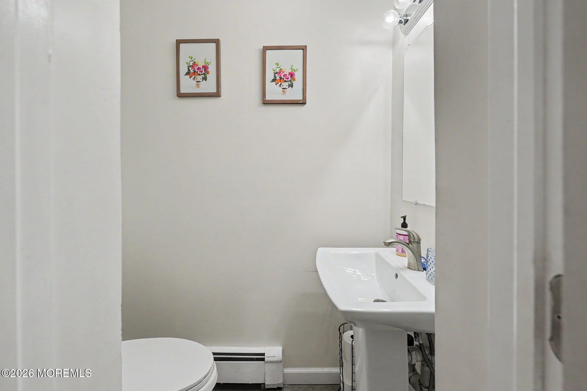699 Aldrich Road Howell, NJ 07731 - Photo 14 of 30 a bathroom with a sink mirror and toilet