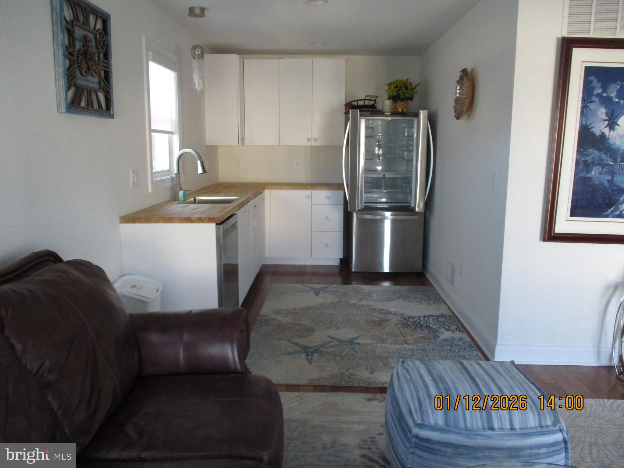 24 West 53rd Street Long Beach Township, NJ 08008 - Photo 11 of 75 a kitchen with stainless steel appliances granite countertop a refrigerator sink and stove