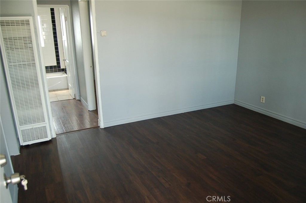 422 West Palm Street, Unit 424 1/2D Compton, CA 90220 - Photo 16 of 17 an empty room with wooden floor