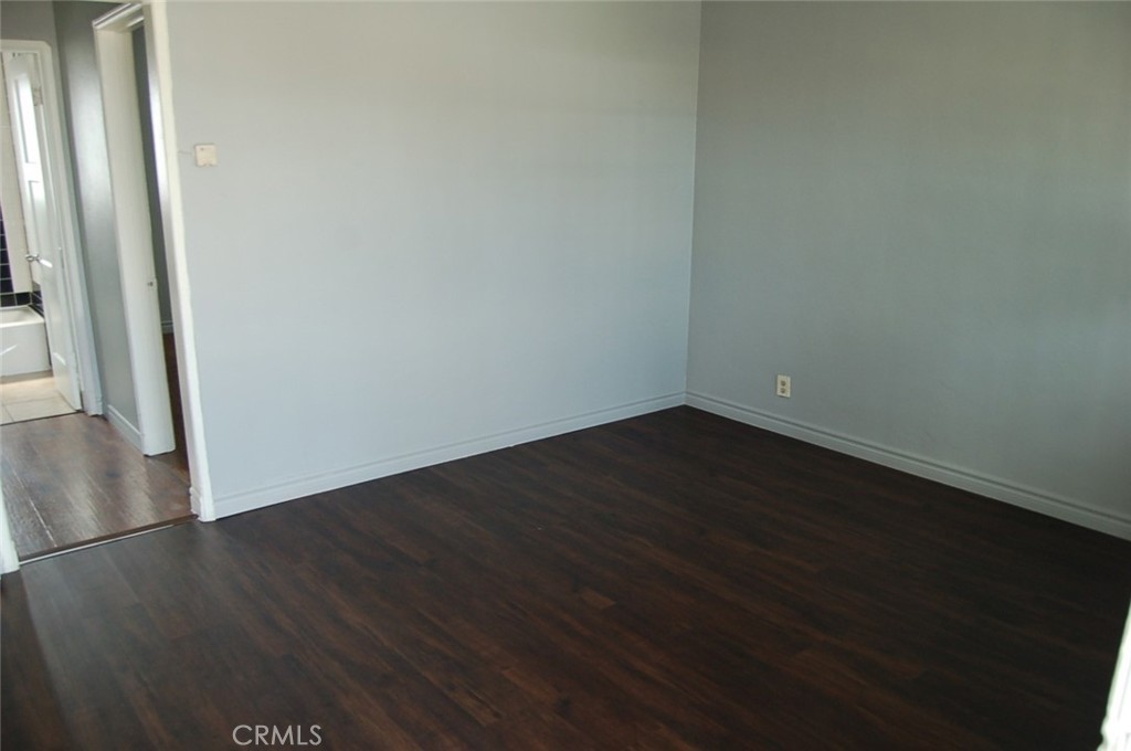 422 West Palm Street, Unit 424 1/2D Compton, CA 90220 - Photo 4 of 17 a view of a small space with wooden floor and a hallway