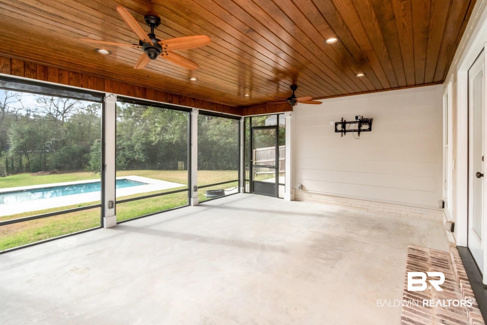 231 Rochester Road Mobile, AL 36608 - Photo 39 of 51 Unfurnished sunroom featuring ceiling fan and a patio