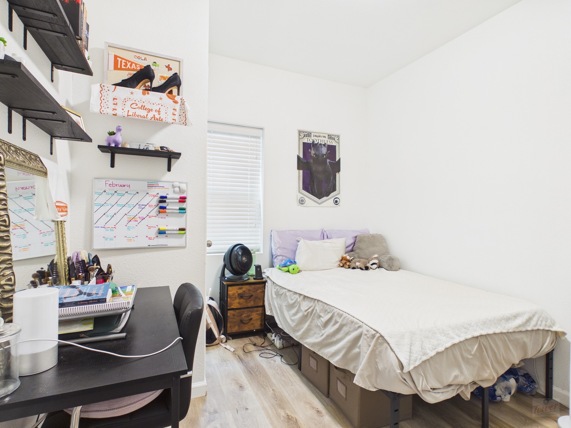 911 West 22nd Street, Unit 403 Austin, TX 78705 - Photo 7 of 13 a bedroom with a bed and a table in it