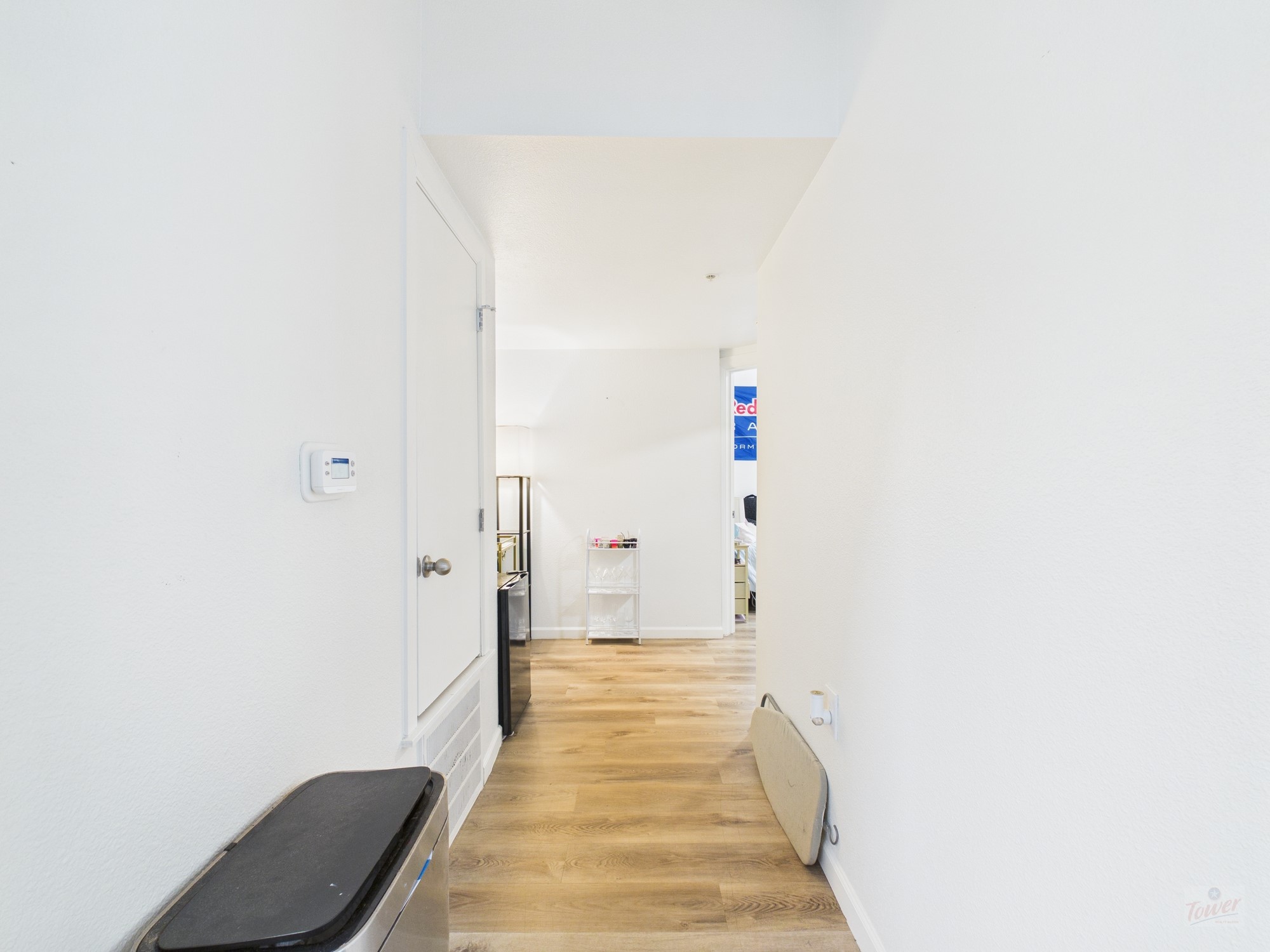 911 West 22nd Street, Unit 403 Austin, TX 78705 - Photo 9 of 13 a view of a hallway with wooden floor