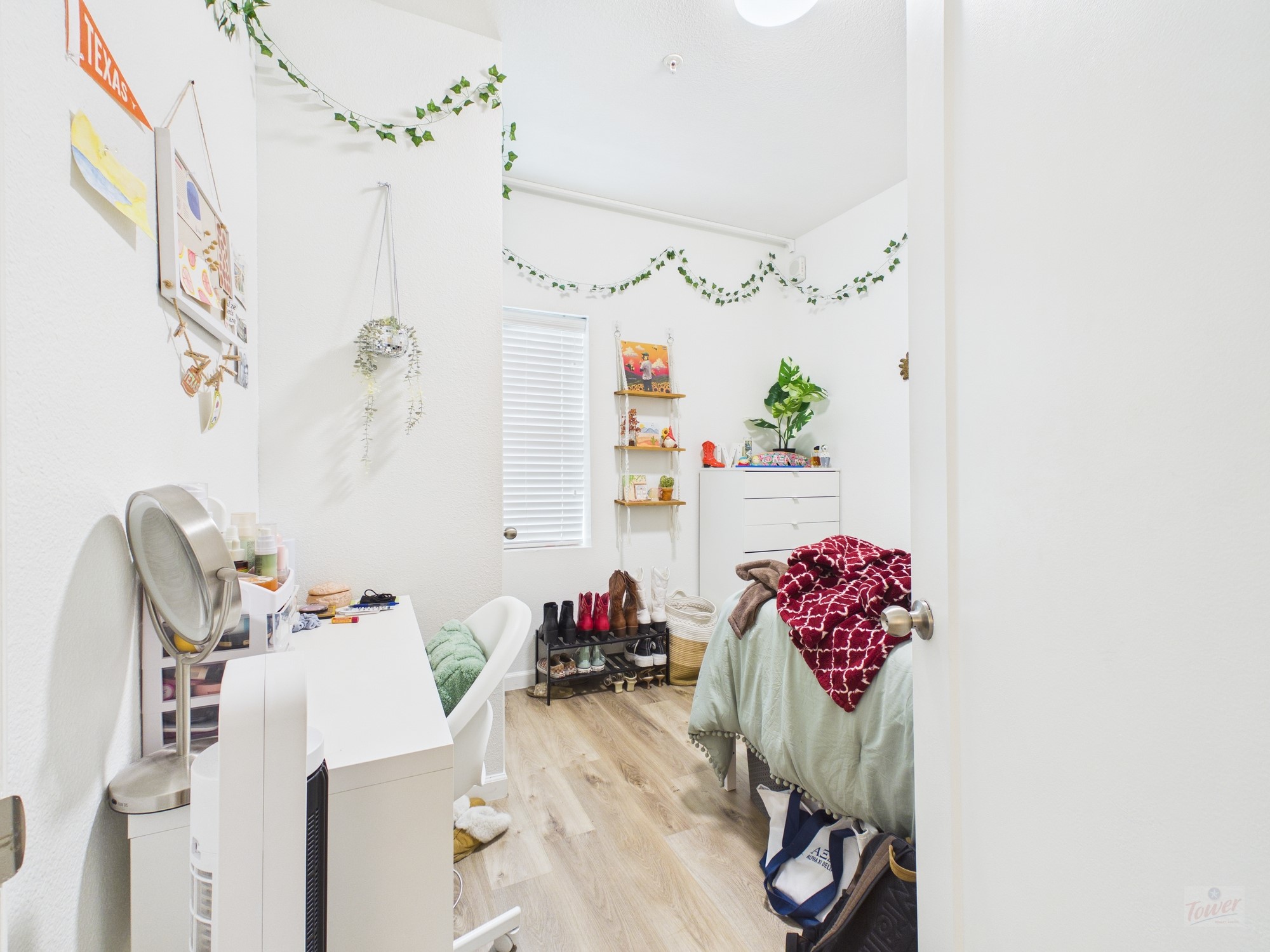 911 West 22nd Street, Unit 403 Austin, TX 78705 - Photo 10 of 13 a bathroom with a sink mirror and flower pot