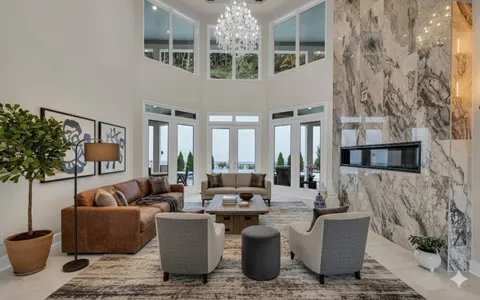 a view of a dining room with furniture wooden floor and chandelier