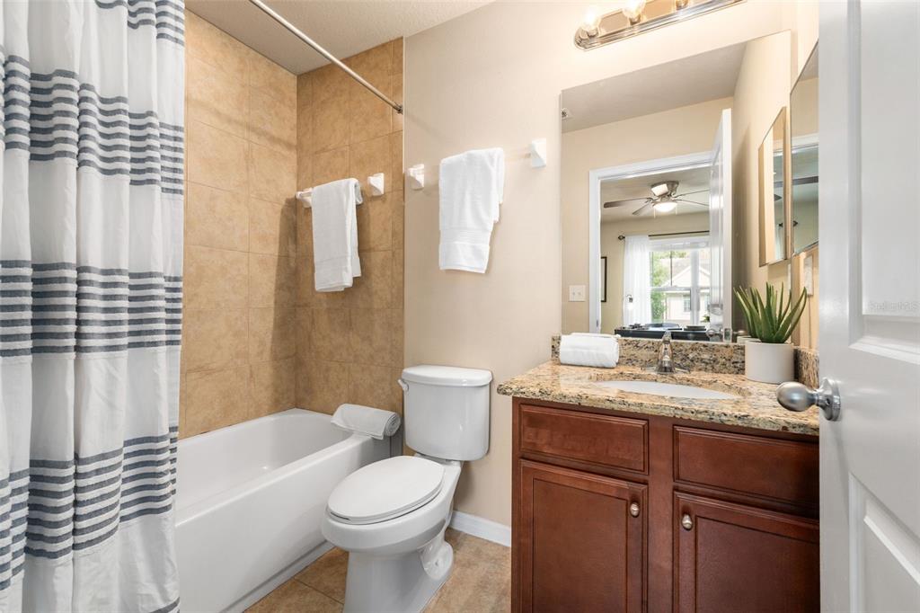 4639 Southwest 48th Drive, Unit 151 Gainesville, FL 32608 - Photo 17 of 26 a bathroom with a sink a toilet and shower