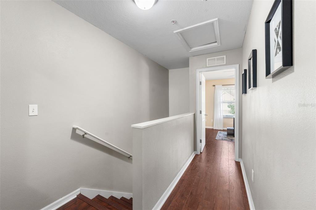 4639 Southwest 48th Drive, Unit 151 Gainesville, FL 32608 - Photo 18 of 26 a view of a hallway with wooden floor