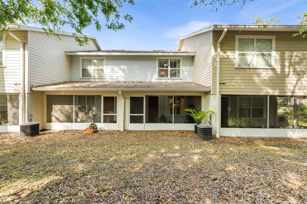 4639 Southwest 48th Drive, Unit 151 Gainesville, FL 32608 - Photo 22 of 26 a front view of a house with a yard
