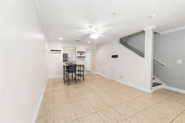 a view of a livingroom with furniture and a ceiling fan