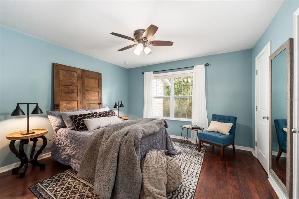 4639 Southwest 48th Drive, Unit 151 Gainesville, FL 32608 - Photo 8 of 26 a bedroom with two beds and a window