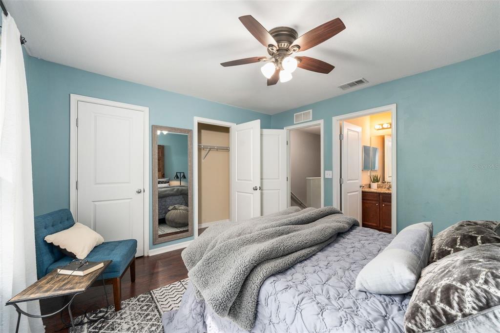 4639 Southwest 48th Drive, Unit 151 Gainesville, FL 32608 - Photo 10 of 26 a bedroom with a large bed and a couch