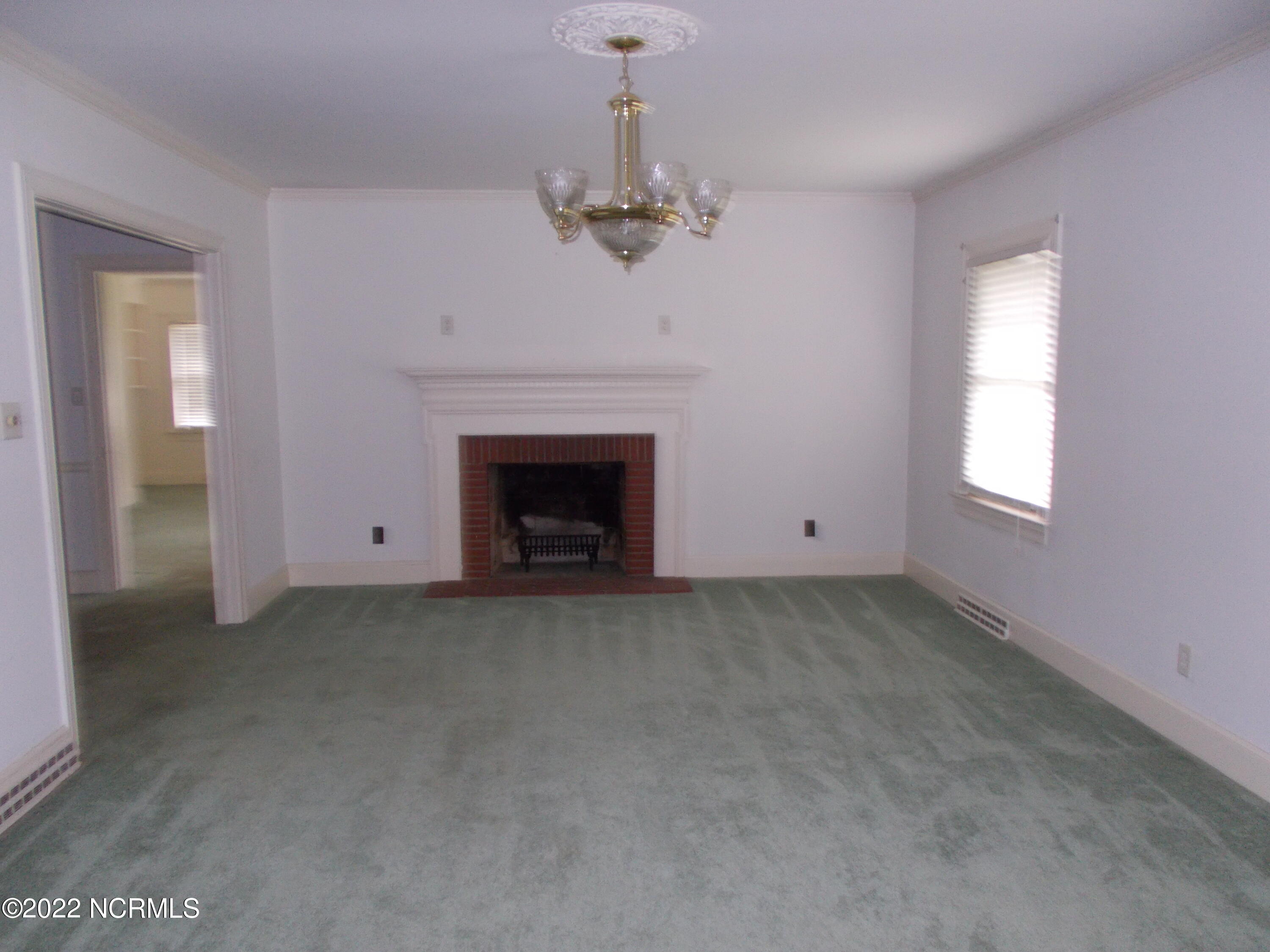 2201 Carey Road Kinston, NC 28504 - Photo 8 of 12 family room with fireplace