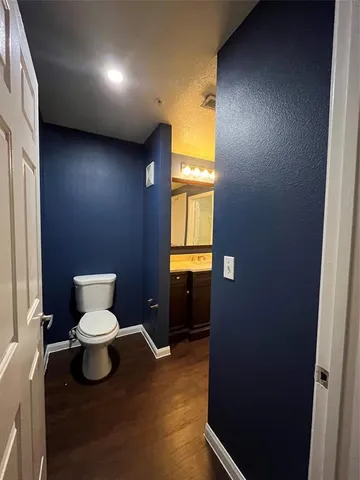a bathroom with a toilet and a sink