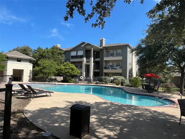 a view of a house with a swimming pool