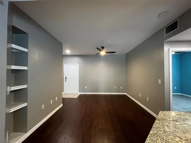 a view of an empty room with a window