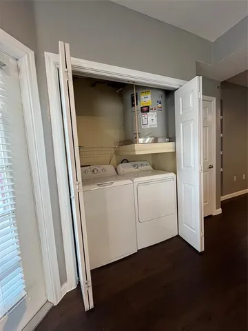 a utility room with closet dryer and washer