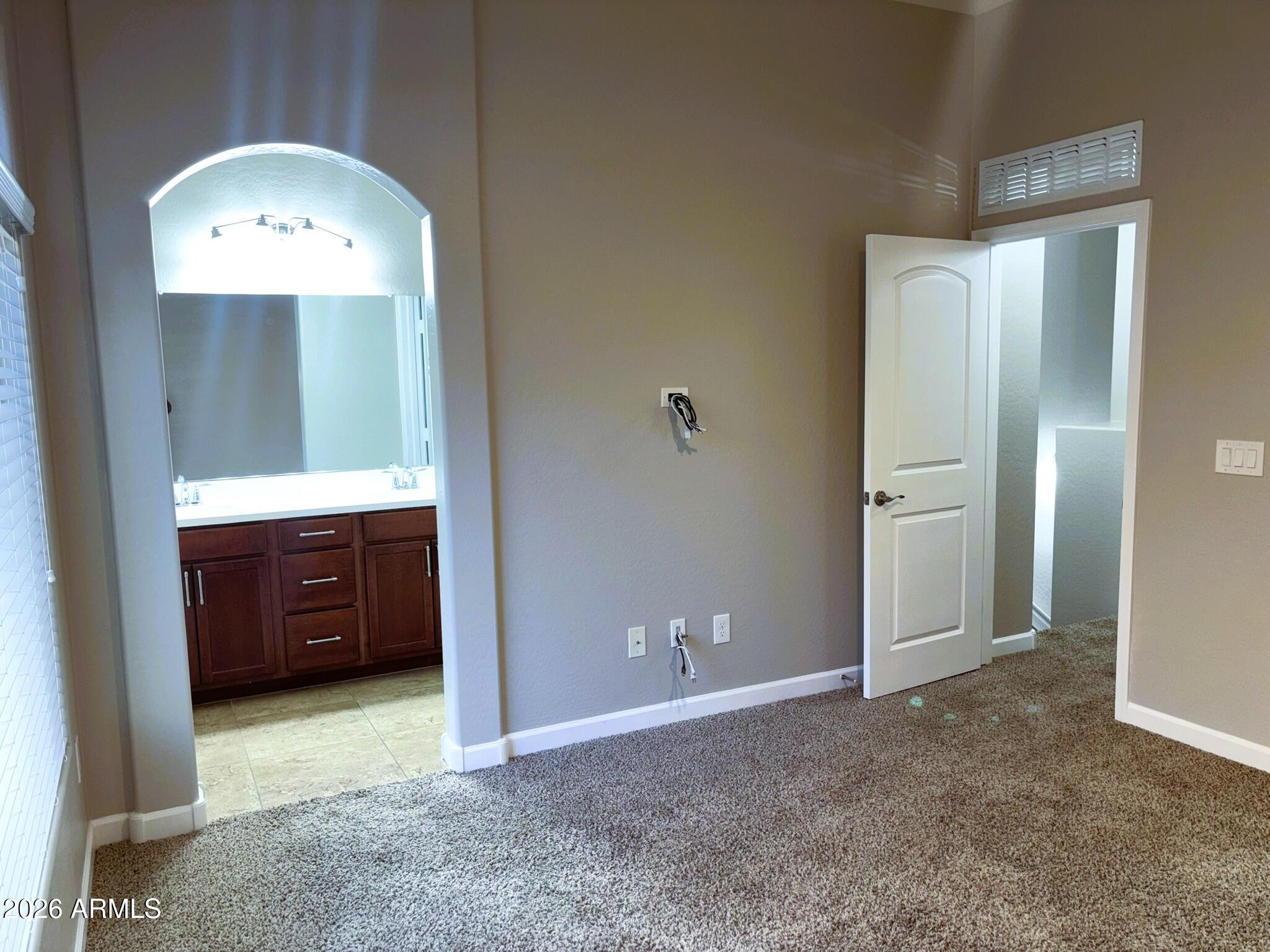2150 West Alameda Road, Unit 1265 Phoenix, AZ 85085 - Photo 12 of 25 a view of a hallway to rooms