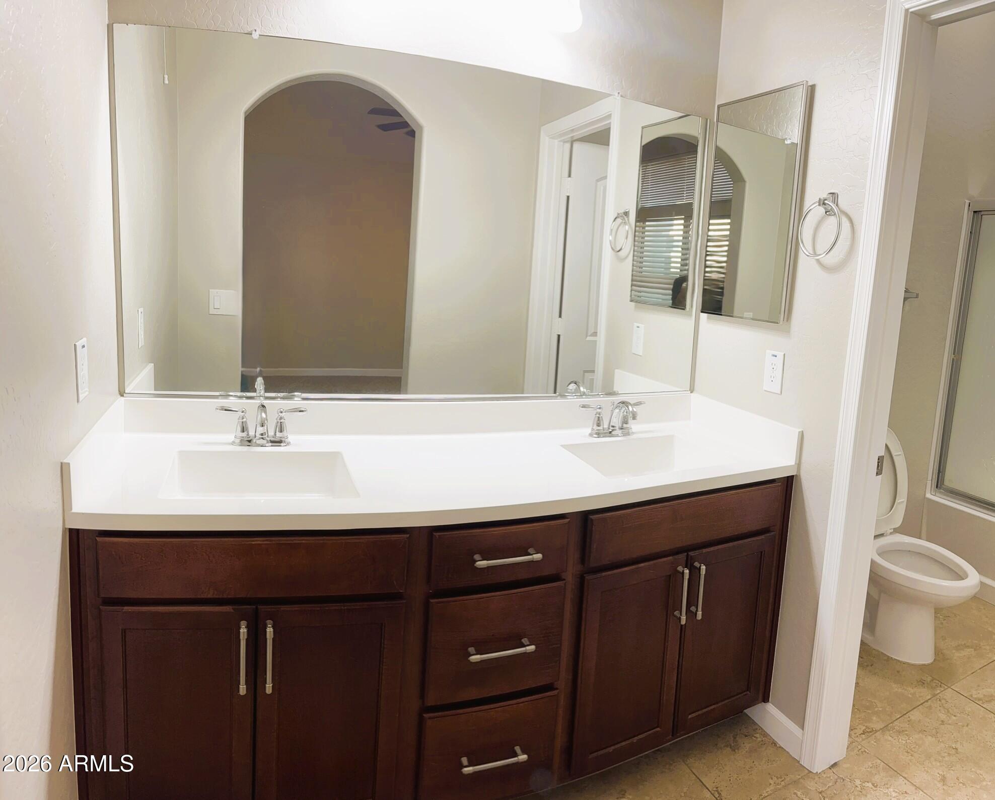 2150 West Alameda Road, Unit 1265 Phoenix, AZ 85085 - Photo 13 of 25 a bathroom with a sink and a mirror