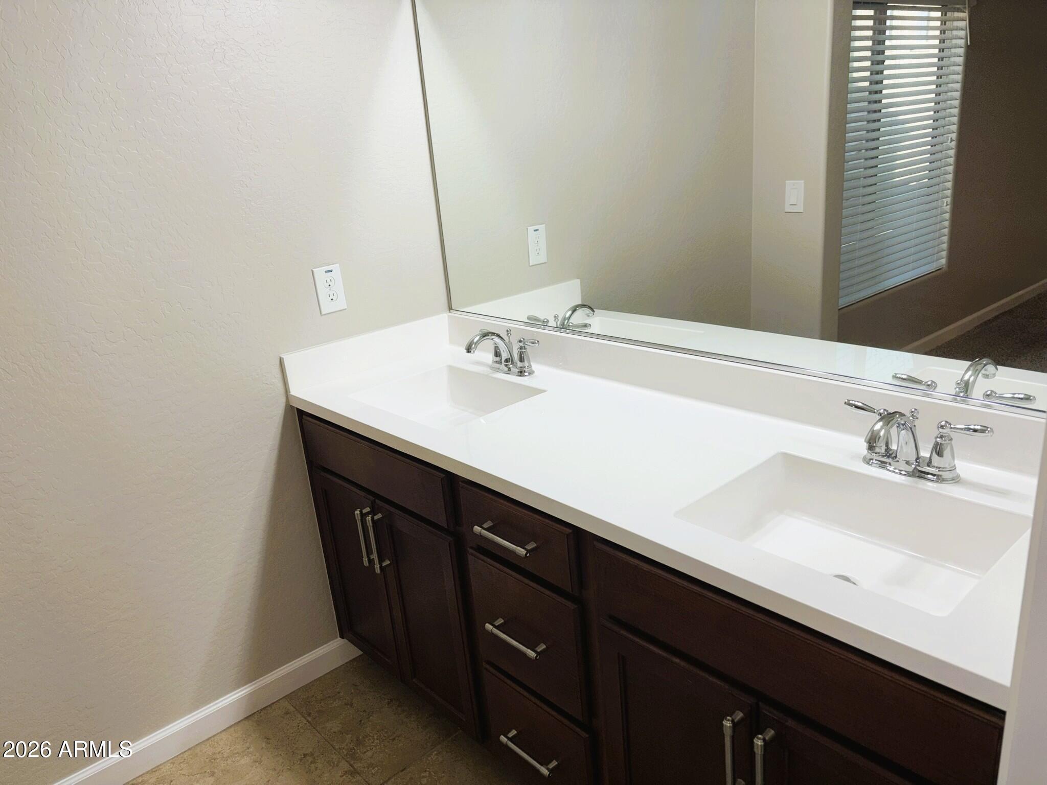 2150 West Alameda Road, Unit 1265 Phoenix, AZ 85085 - Photo 15 of 25 a bathroom with a sink and a mirror