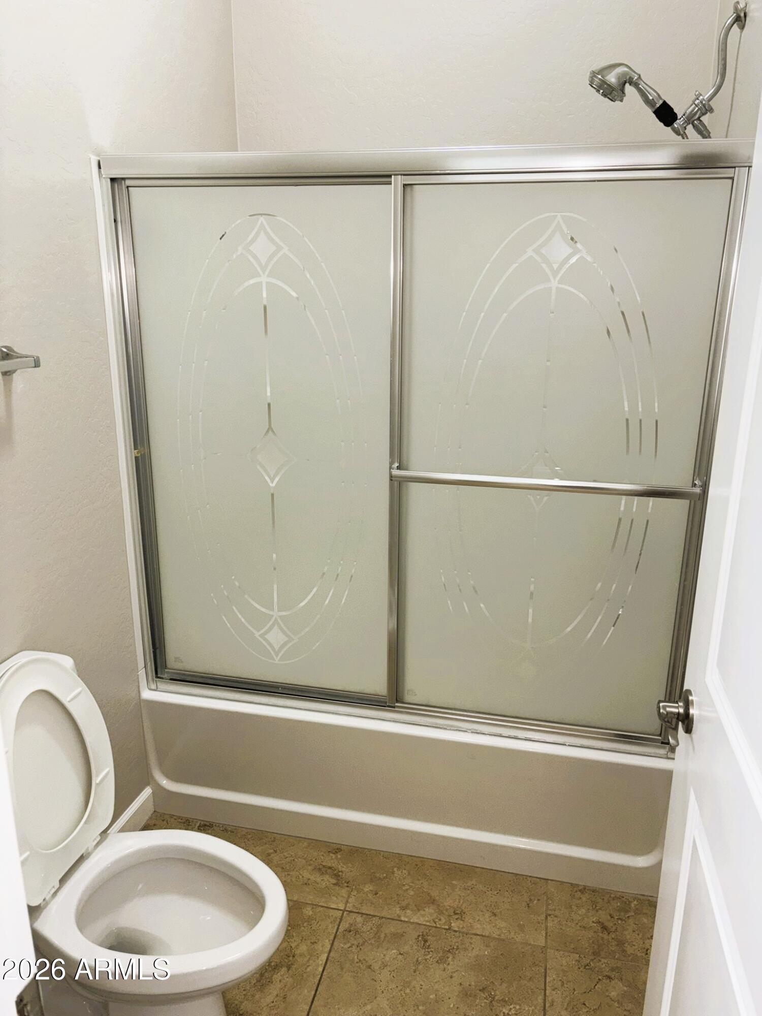 2150 West Alameda Road, Unit 1265 Phoenix, AZ 85085 - Photo 16 of 25 a bathroom with a shower and a toilet