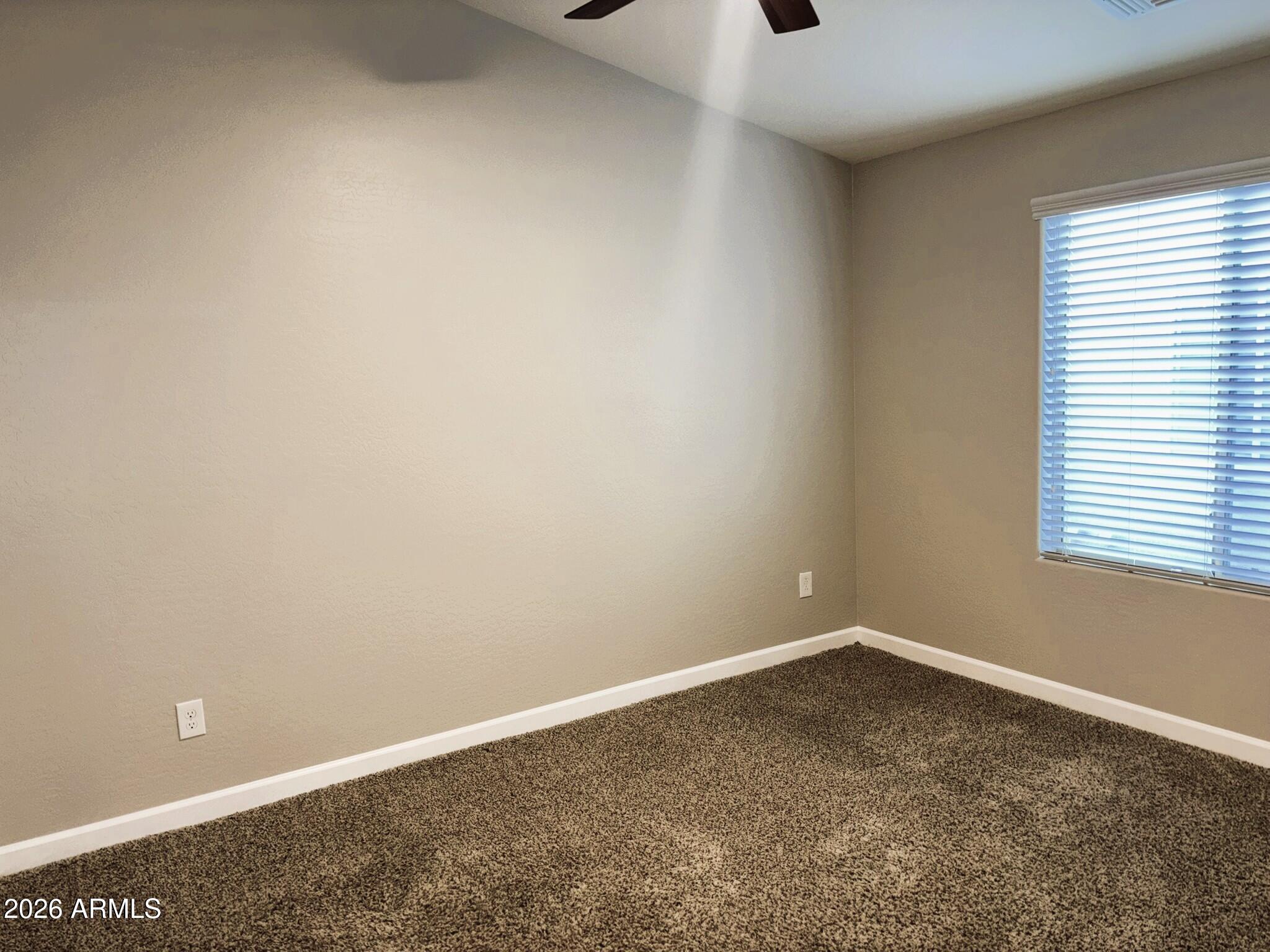 2150 West Alameda Road, Unit 1265 Phoenix, AZ 85085 - Photo 18 of 25 an empty room with a window