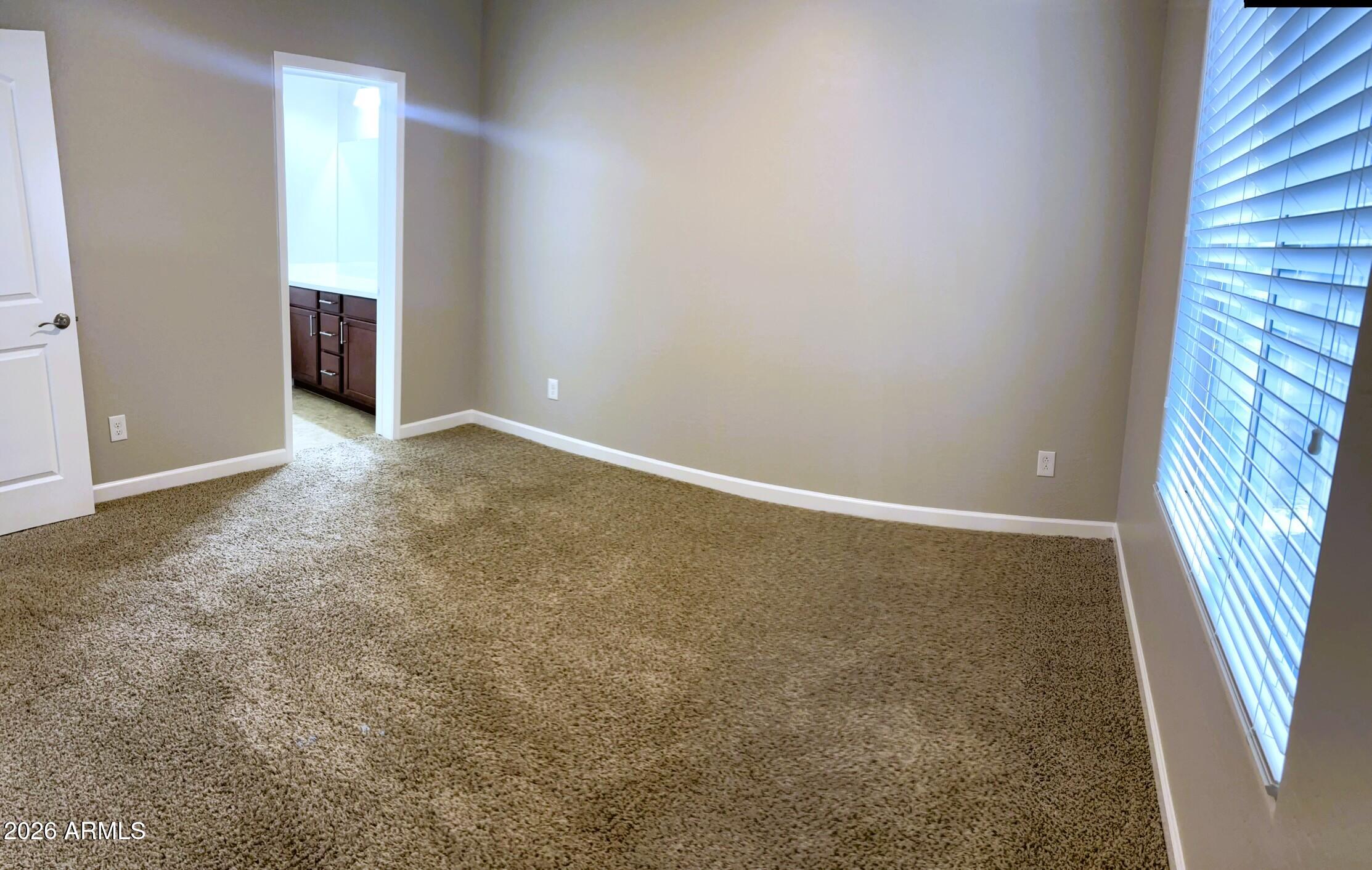 2150 West Alameda Road, Unit 1265 Phoenix, AZ 85085 - Photo 19 of 25 an empty room with windows