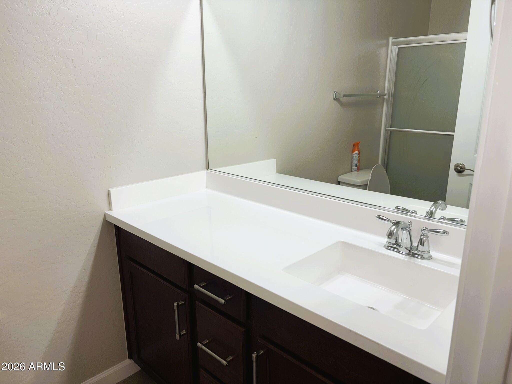 2150 West Alameda Road, Unit 1265 Phoenix, AZ 85085 - Photo 20 of 25 a bathroom with a sink and a mirror
