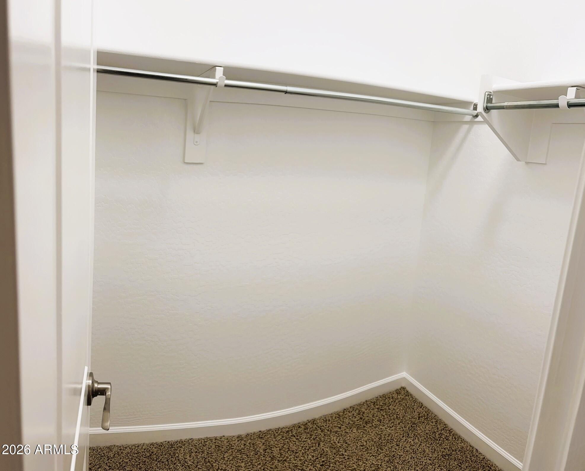 2150 West Alameda Road, Unit 1265 Phoenix, AZ 85085 - Photo 22 of 25 a view of a room with racks on the wall