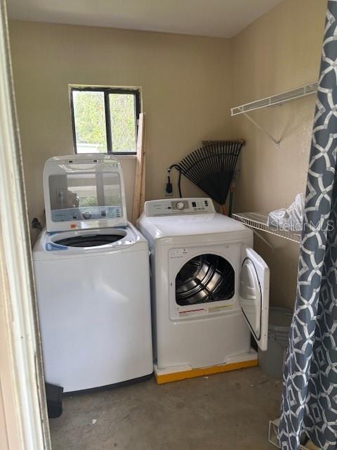 10405 Southwest 98th Terrace Ocala, FL 34481 - Photo 15 of 18 a utility room with dryer and washer