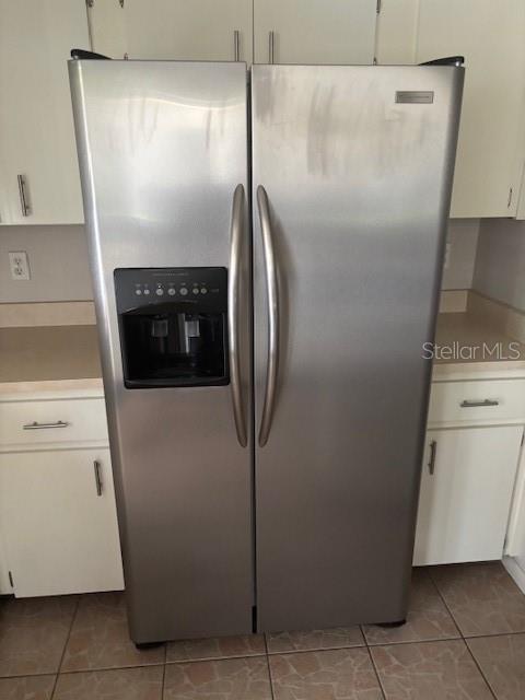 10405 Southwest 98th Terrace Ocala, FL 34481 - Photo 6 of 18 a close view of a refrigerator in kitchen and a stove