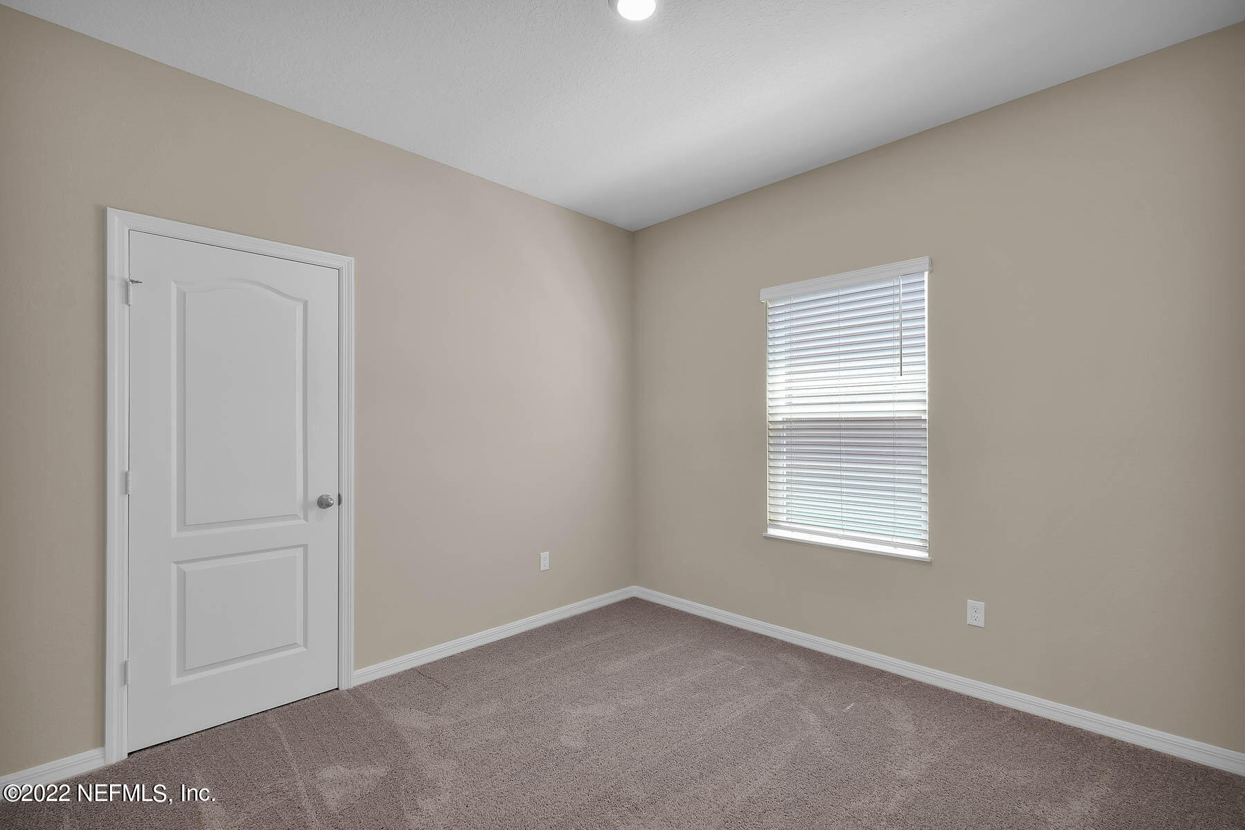 80 Falcon Ridge Road St. Augustine, FL 32084 - Photo 7 of 11 an empty room with a window