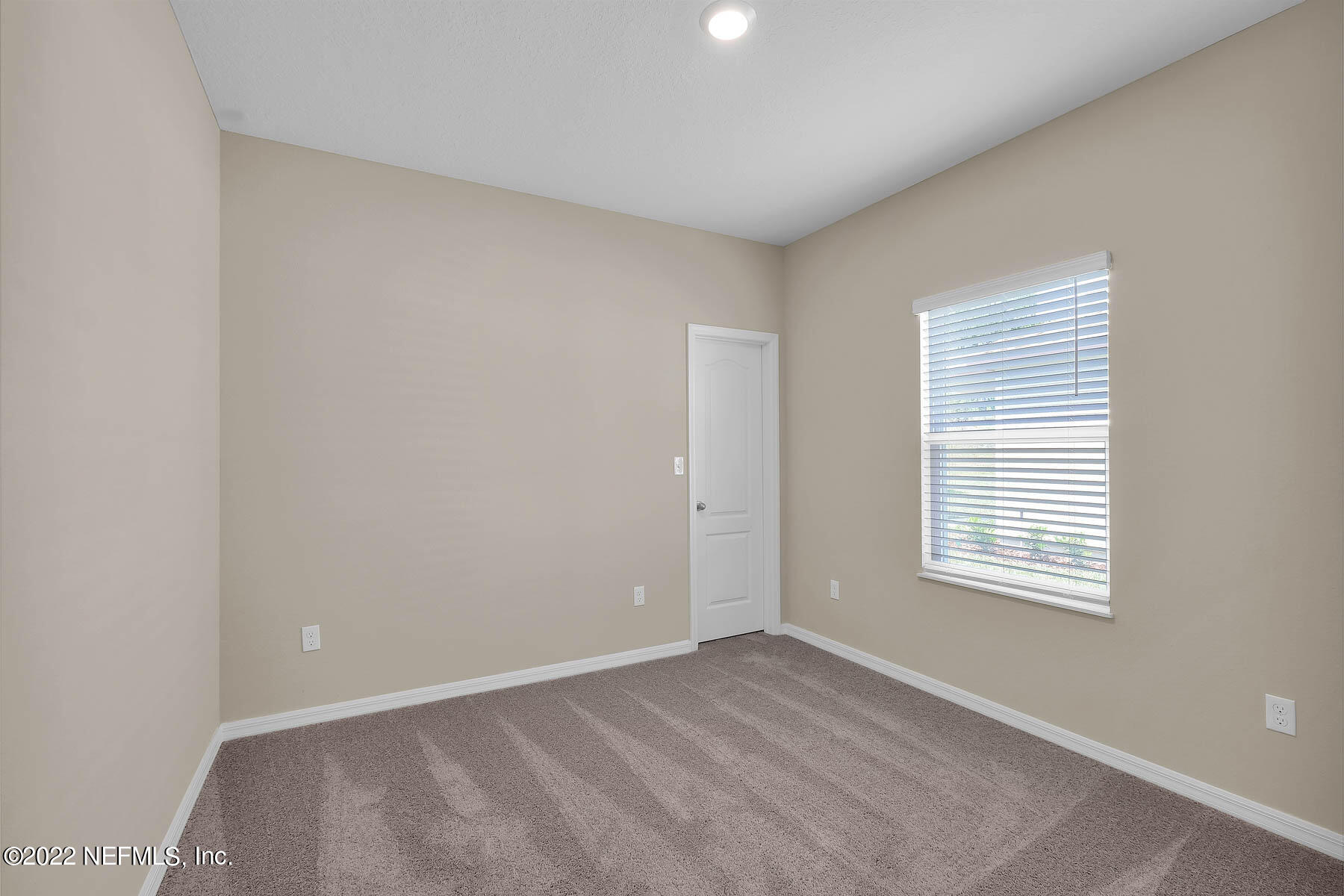 80 Falcon Ridge Road St. Augustine, FL 32084 - Photo 8 of 11 a view of an empty room with a window